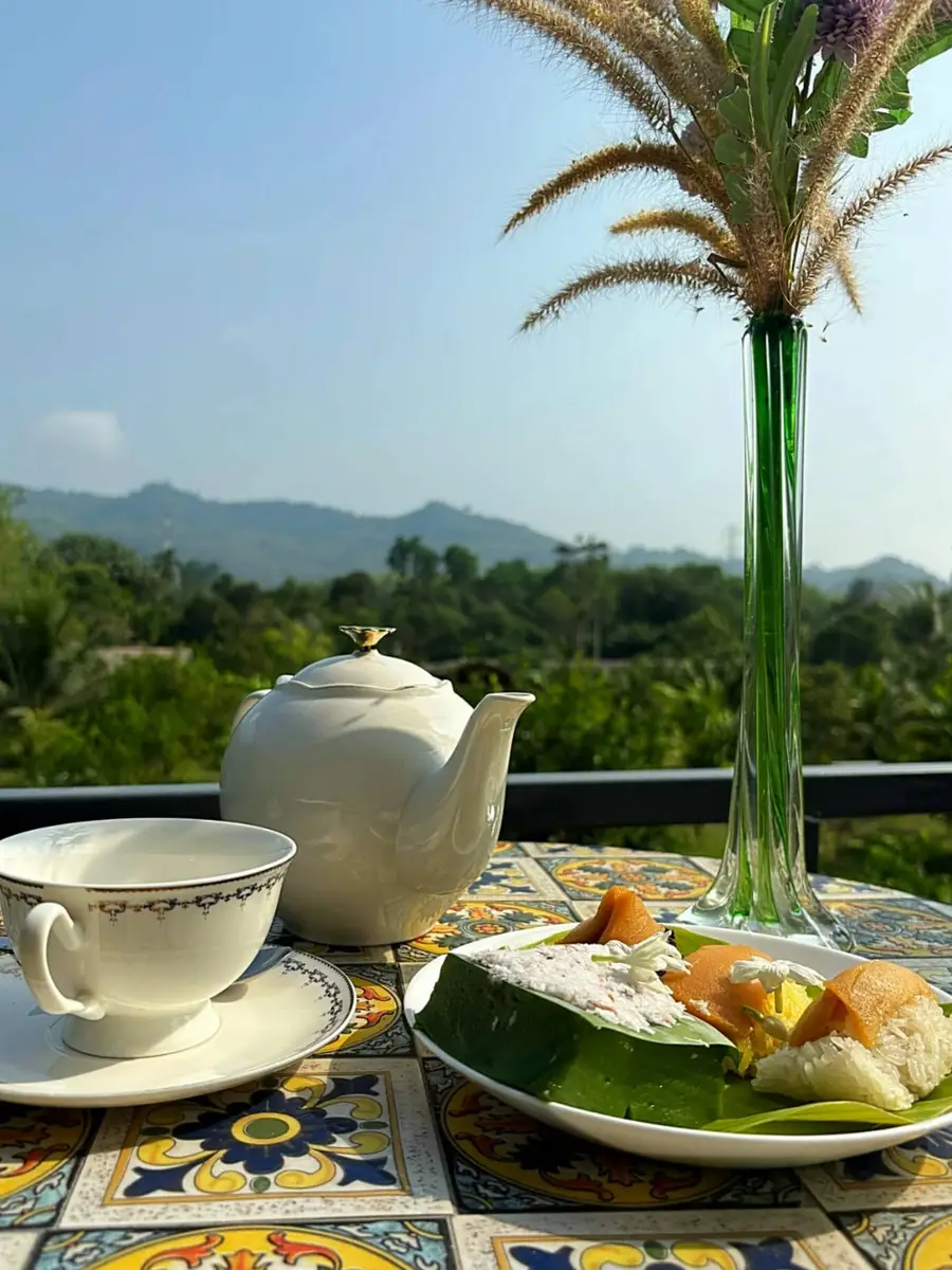 Tea set on the balcony overlooking the hills