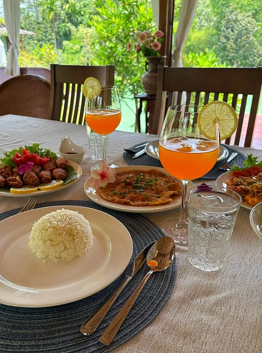 Thai dinner served with fresh juice