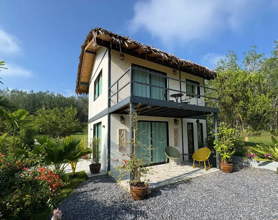 The two-storey garden house under a blue sky