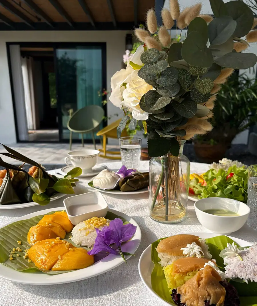 Thai breakfast with sticky rice and fresh flowers